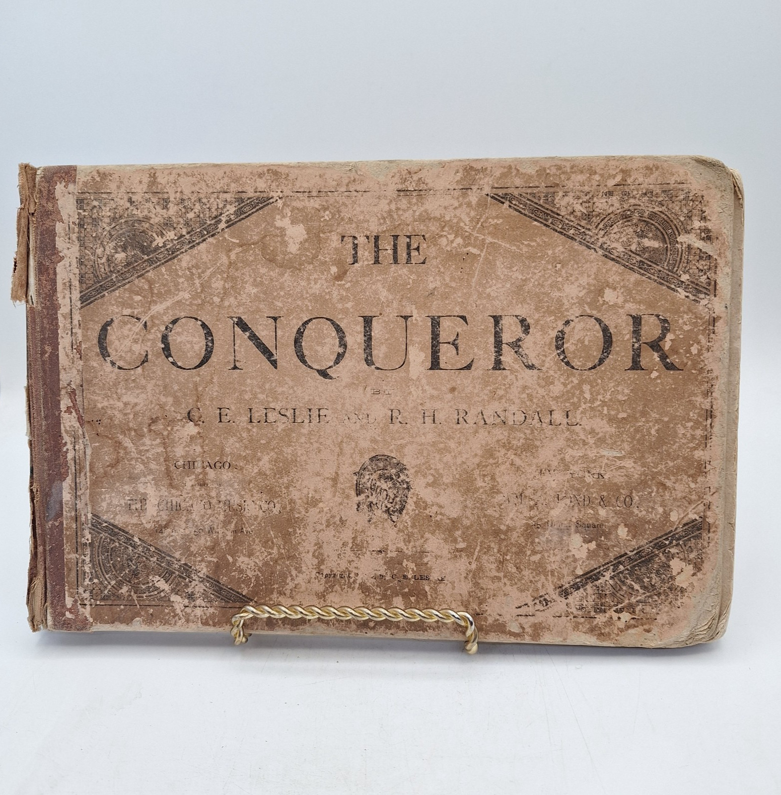 The CONQUEROR by Leslie & Randall ` 1880 HC Song book with Railroad Ads