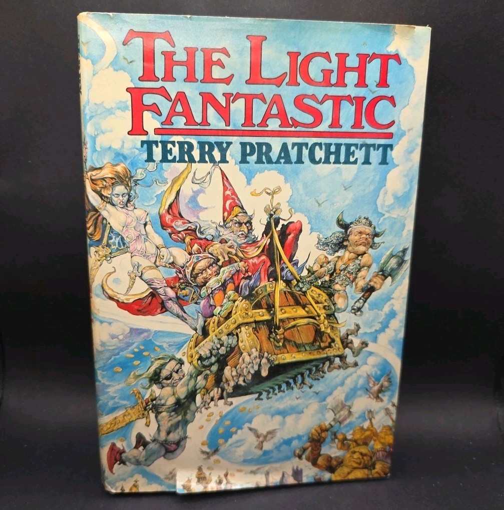 Pratchett THE LIGHT FANTASTIC 1st Printing HCDJ 1986 – w/ Issue Points Near Fine