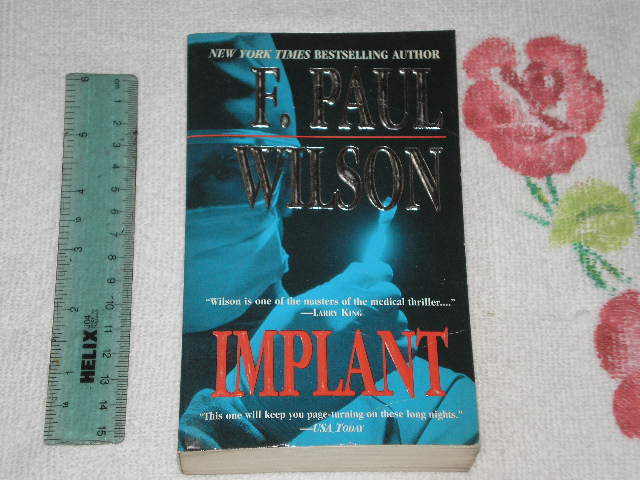 Implant by F. Paul Wilson *Signed* -pb-