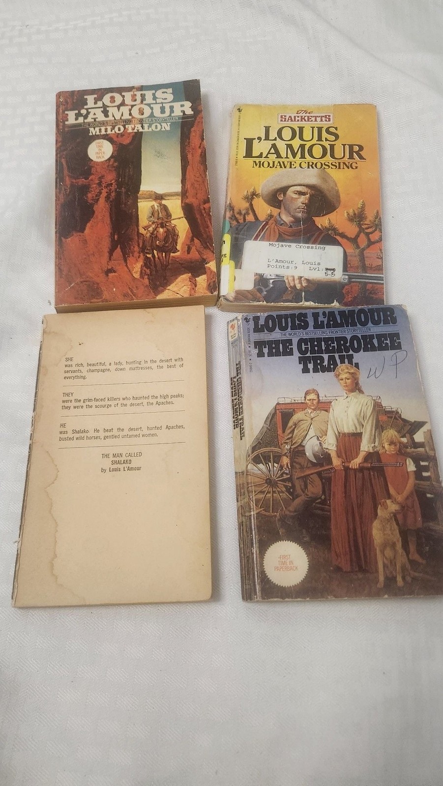 Lot of 4 Louis L’Amour Western Paperbacks: Milo Talon, Mojave Crossing, and The