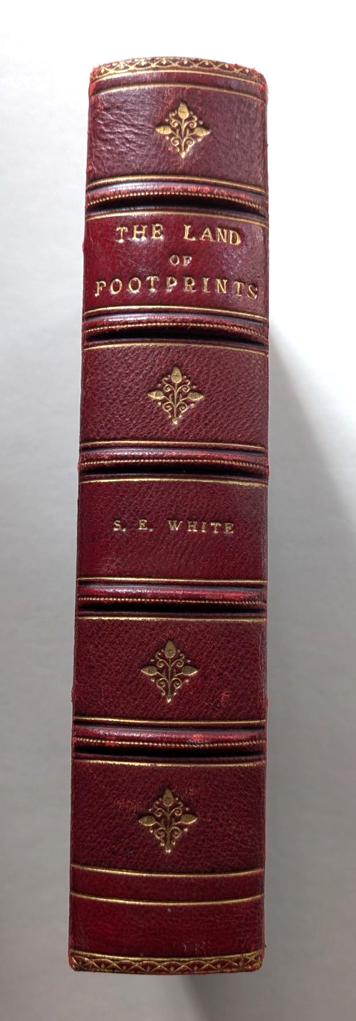 THE LAND OF THE FOOTPRINTS Stewart White Full Red Leather School Prize Binding