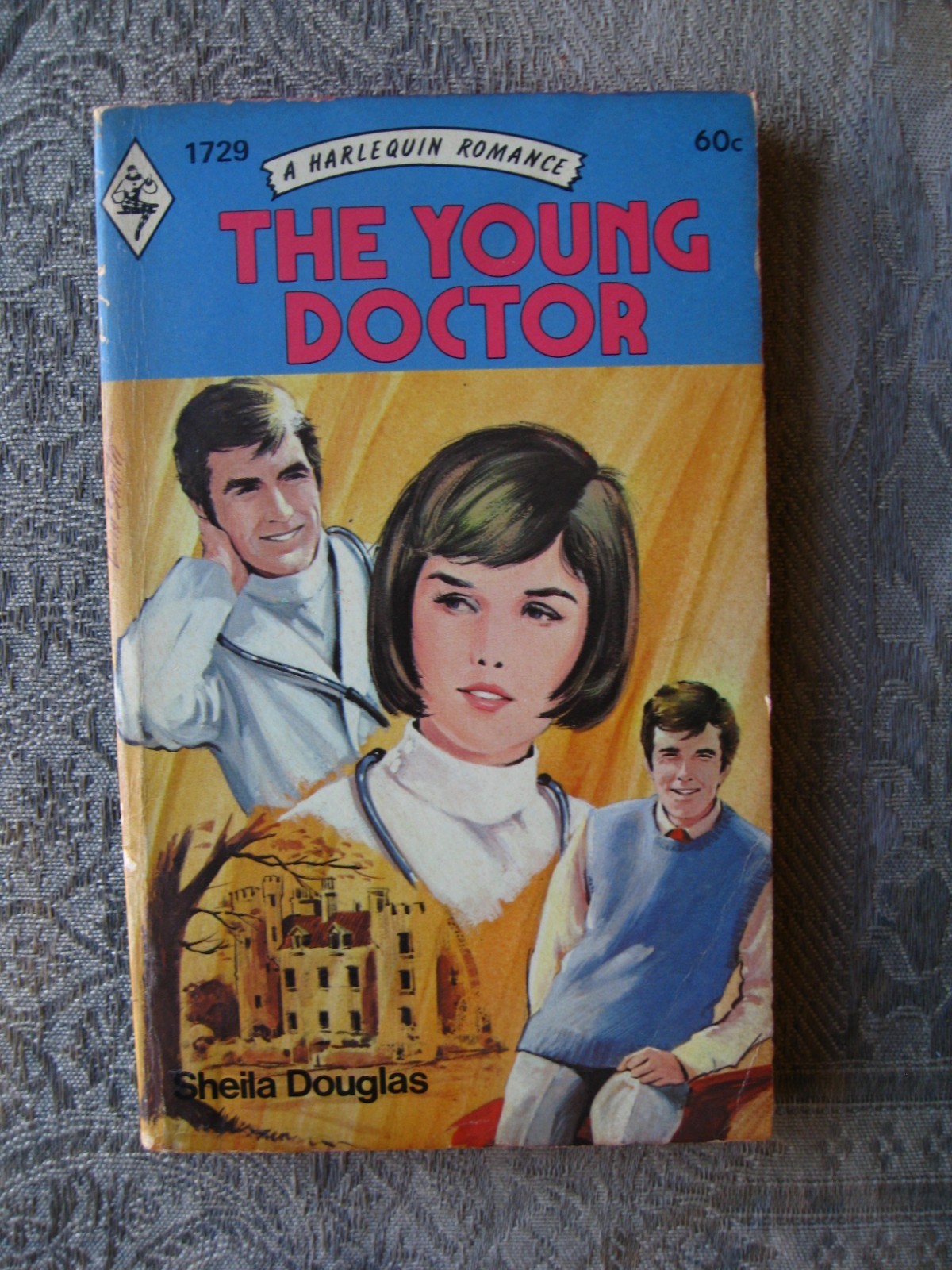 Sheila Douglas – The Young Doctor (Harlequin Romance #1729) 1973 – paperback
