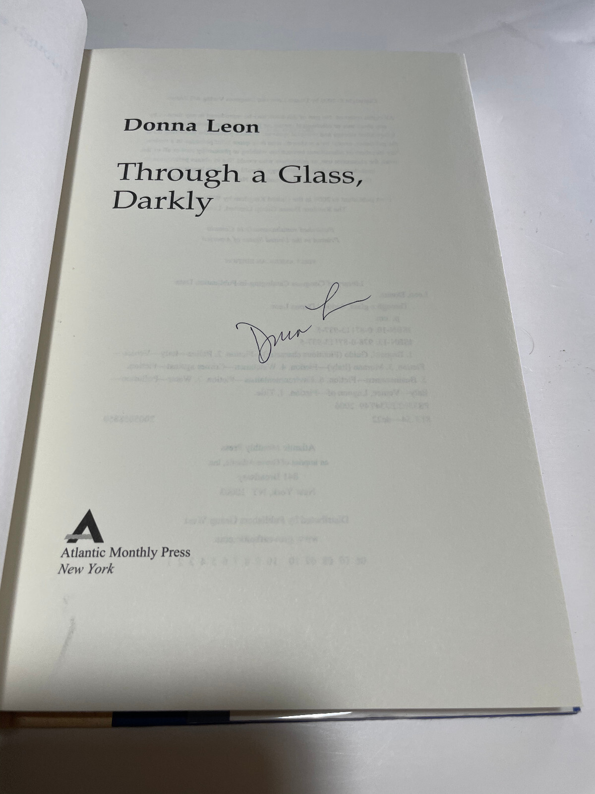 Signed Donna Leon: Through a Glass Darkly, signed 1st HB