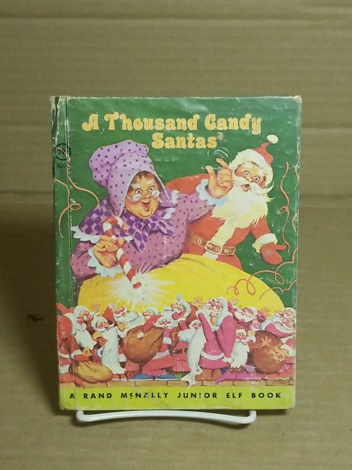 1977 Rand McNally Junior Elf Book A Thousand Candy Santas by Daphne Hogstrom